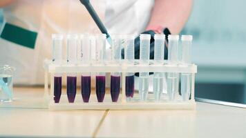 Research in the laboratory. A solution that is added to a test tube and changes color. video