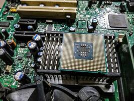 Computer processor and motherboard, microchip details close view. Hi-tech innovation background photo