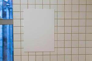 Empty paper picture mockup, simple blank sheet of paper on the wall template photo