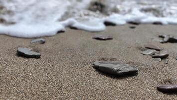 Stones on the sand sea beach. Summer vacation wallpaper background photo