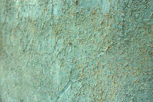 A close up of a wall with paint peeling off photo