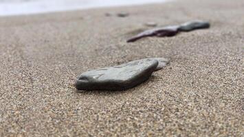 piedras en el arena mar playa. verano vacaciones fondo de pantalla antecedentes foto