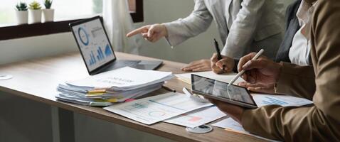 business adviser meeting to analyze and discuss the situation on the financial report in the meeting room.Investment Consultant, Financial advisor and accounting concept photo