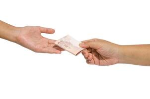 Hand handing over money to another hand photo