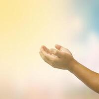 open hand on blurred abstract nature background - concept help photo