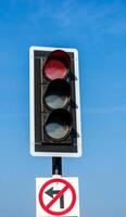 Traffic lights against sky backgrounds photo