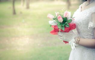 Beautiful bouquet of flowers in hand the bride. photo