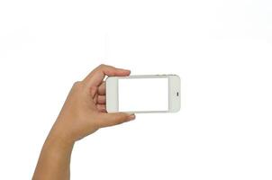 Hand holding smart phone isolated on white background photo