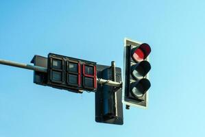 Traffic lights against sky backgrounds photo