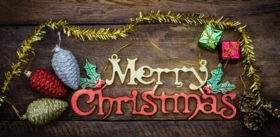 Merry Christmas greeting message on wooden background photo