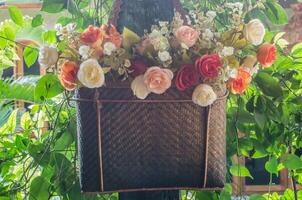 Flowers in the garden planted in a basket photo