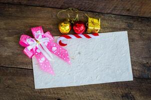 card for Christmas on wood background photo