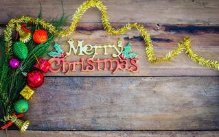 Merry Christmas greeting message on wooden background photo