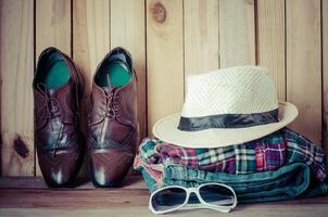 Travel accessories. Shirts, jeans, hats,shoes, ready for the trip photo