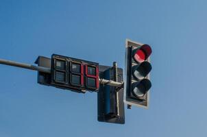 Traffic lights against sky backgrounds photo