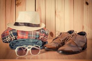 Travel accessories. Shirts, jeans, hats,shoes, ready for the trip photo