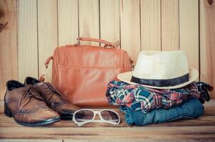 Travel accessories. Shirts, jeans, hats,shoes, ready for the trip photo