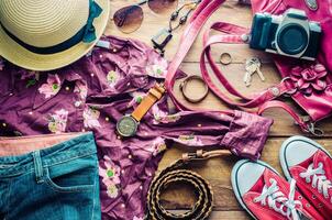 Travel accessories and costume on wooden floor photo