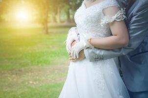 Weding in park with golden light in the morning photo