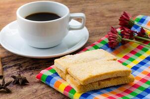 Coffee, biscuits, breakfast on the wooden floor. photo