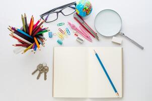 School supplies placed on a white background concept ready for school. photo