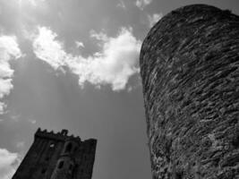 Old celtic castle towers background, Blarney castle in Ireland, old ancient celtic fortress photo