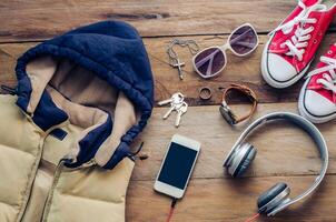 Travel Clothing accessories on wooden floor for the trip photo