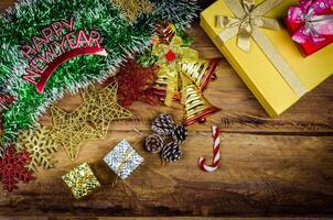 Happy New Year message and gift box on wooden background. photo