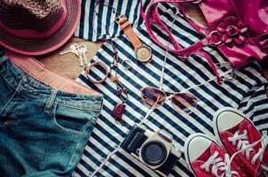 Travel accessories and costume on wooden floor photo