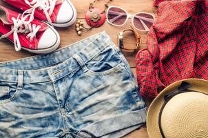 Clothing and accessories for women with summer on wood floor photo