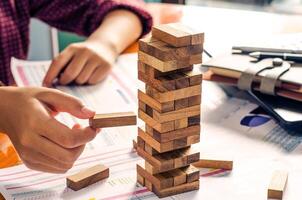 Business risks in the business. Requires planning Meditation must be careful in deciding to reduce the risk in the business. As the game drew to a wooden block from the tower photo