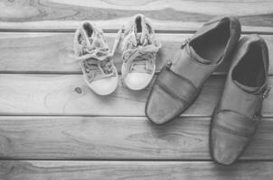 shoes for dad and daughter tone black and white - concept protect photo