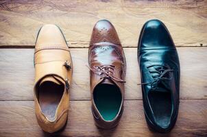 Leather shoes lay on the wooden floor concept for work photo