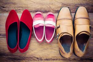 shoes, three pairs of dad, mom, son - the family concept photo