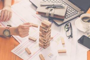 Business risks in the business. Requires planning Meditation must be careful in deciding to reduce the risk in the business. As the game drew to a wooden block from the tower photo