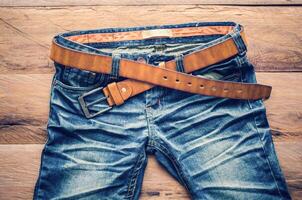 Jeans on a wooden floor photo