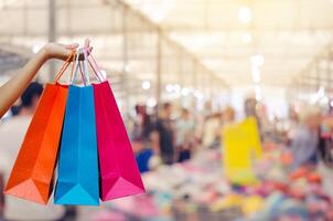 Woman with shopping bags in shopping mall photo