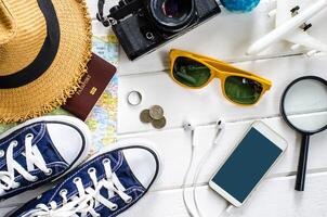 Travel accessories and costume on white background photo