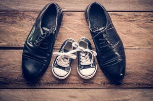 The shoes of father and son concept. father son photo