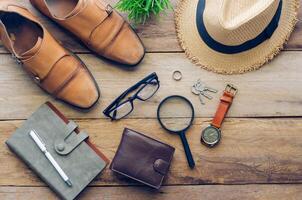 Apparel business and working equipment placed on the wooden floor. photo