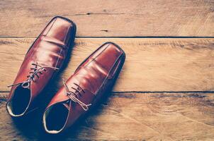 Leather shoes on the wooden floor. photo