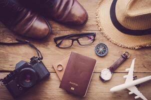 Travel accessories on wooden floor ready for travel photo