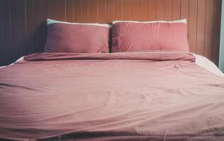 Bed with pillows and brown bedspread photo