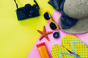 Clothing accessories for summer on multicolor paper floor - concept lifestyle photo