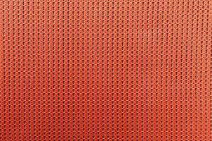 fabric orange colored background with light penetrating through photo