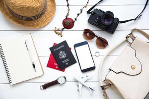 women. Passports, The cost of travel maps prepared for the trip on white wood floor photo