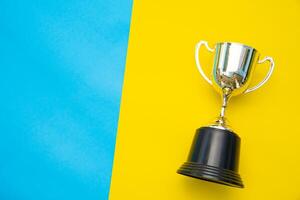 Top view for trophy placed on a colorful background. photo
