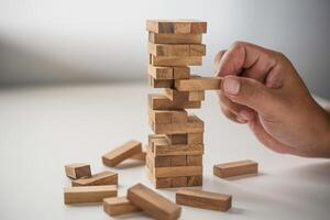 Business risks in the business. Requires planning Meditation must be careful in deciding to reduce the risk in the business. As the game drew to a wooden block from the tower photo