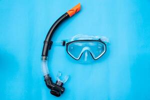 Diving Mask and Snorkel on wooden floor photo