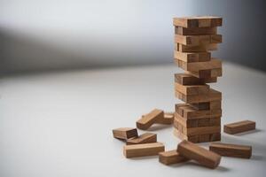 Business risks in the business. Requires planning Meditation must be careful in deciding to reduce the risk in the business. As the game drew to a wooden block from the tower photo